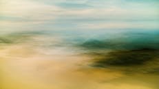 Abstract foggy landscape with soft colors, capturing serene beauty, evocative of Ko Lanta Yai, Thailand.